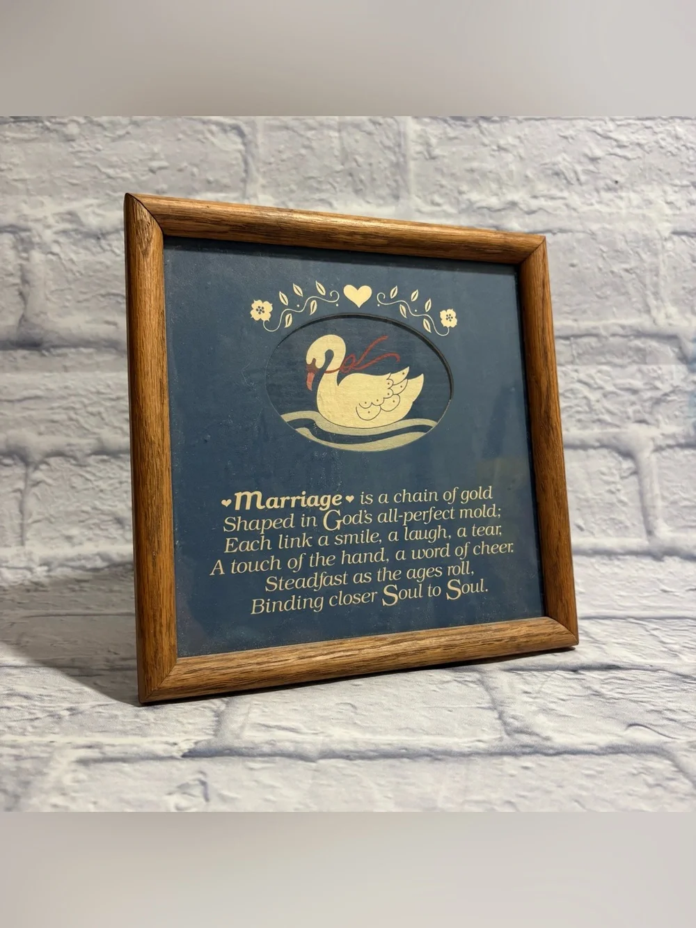 Vintage wooden framed illustrated swan “Marriage Is A Gold Chain” wall decor